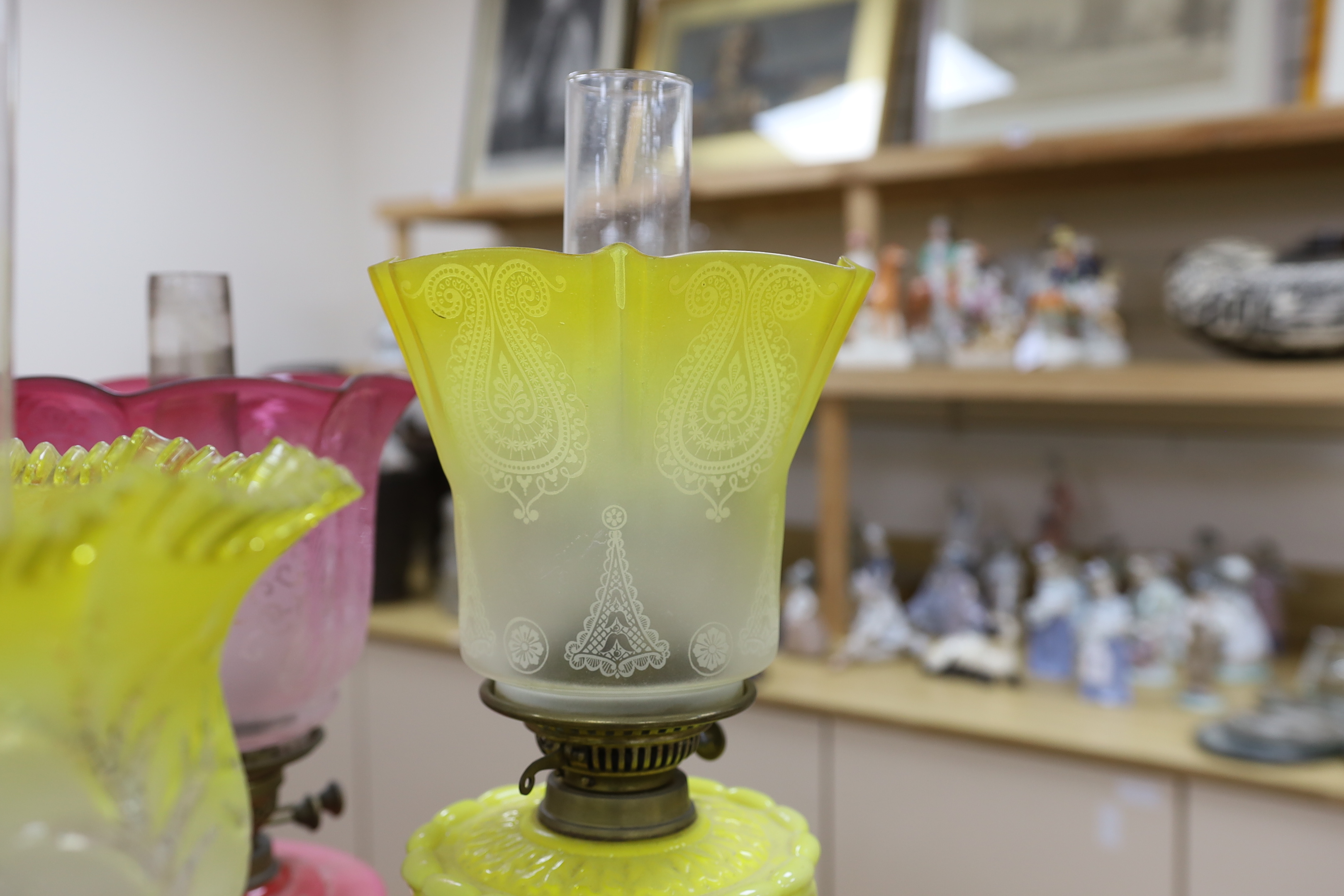 Four Victorian/Edwardian oil lamps with glass shades, tallest 69cm